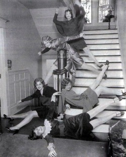 Girls goofing off on stairs, location unknown,