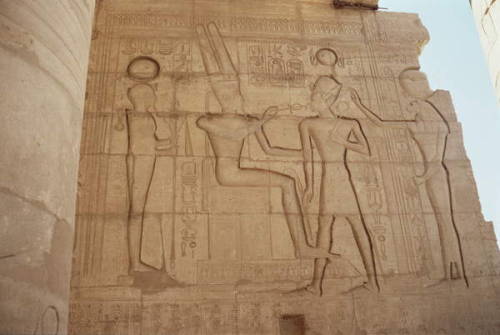 Relief depicting the lioness-headed goddess Tefnut presenting Ramesses II to an enthroned Amun, who 