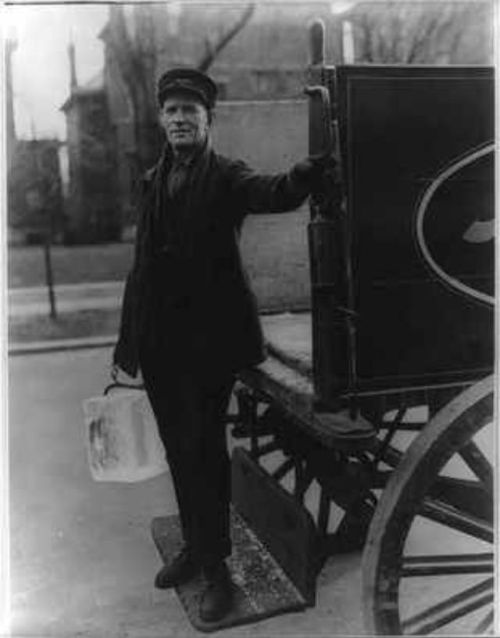 The ice man delivering blocks of ice for household iceboxes (1923).