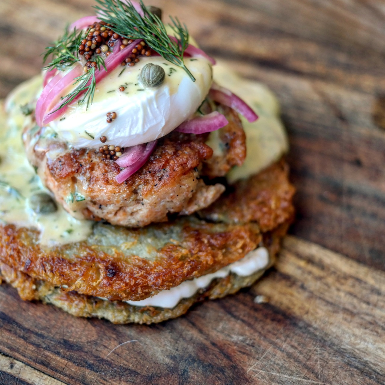 foodpornit:  Eggs Benedict w/ butter basted rosemary salmon cake on potato pancakes