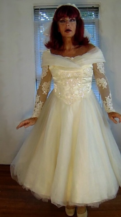 This breathtaking 1950s era wedding dress is modeled by Cindy, a crossdresser.