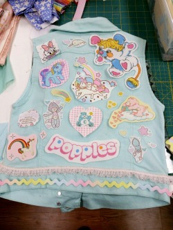 mahouprince:  lithefider:  I obtained a mint colored denim vest and am planning to pimp the hell out of it with pastel goodness new and old.  Here is a planned layout for the back (nothing is sewn on yet).  I tried to go for mostly vintage fabric from