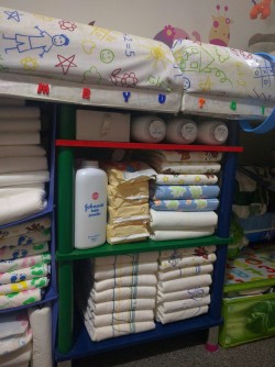 abcubs:  Restocking the changing table for