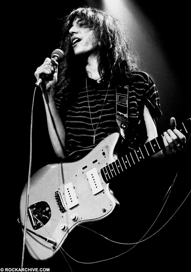 soundsof71:  Patti Smith in the Netherlands, having busted allllll the strings, 1980,