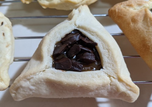 Hamantaschen! The quality is variable but the flavor is fine! These were made with the cookie recipe