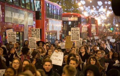 stereoculturesociety:  CultureHISTORY: #FergusonDecision Protests - London - Nov. 26, 2014 All from tonight in London in front of the U.S. Embassy. Photo #6 (three people) features the family of Mark Duggan who was shot by police in Tottenham, North