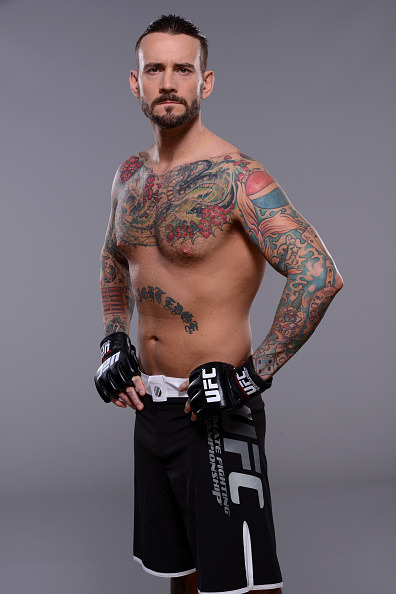 thepunknation:UFC Photoshoot Part One‘DALLAS, TX - MARCH 13:  Phil ‘CM Punk’ Brooks poses for a  photo during a UFC photo session at the Hilton Anatole Hotel on March  13, 2015 in Dallas, Texas. (Photo by Mike Roach/Zuffa LLC/Zuffa LLC via  Getty