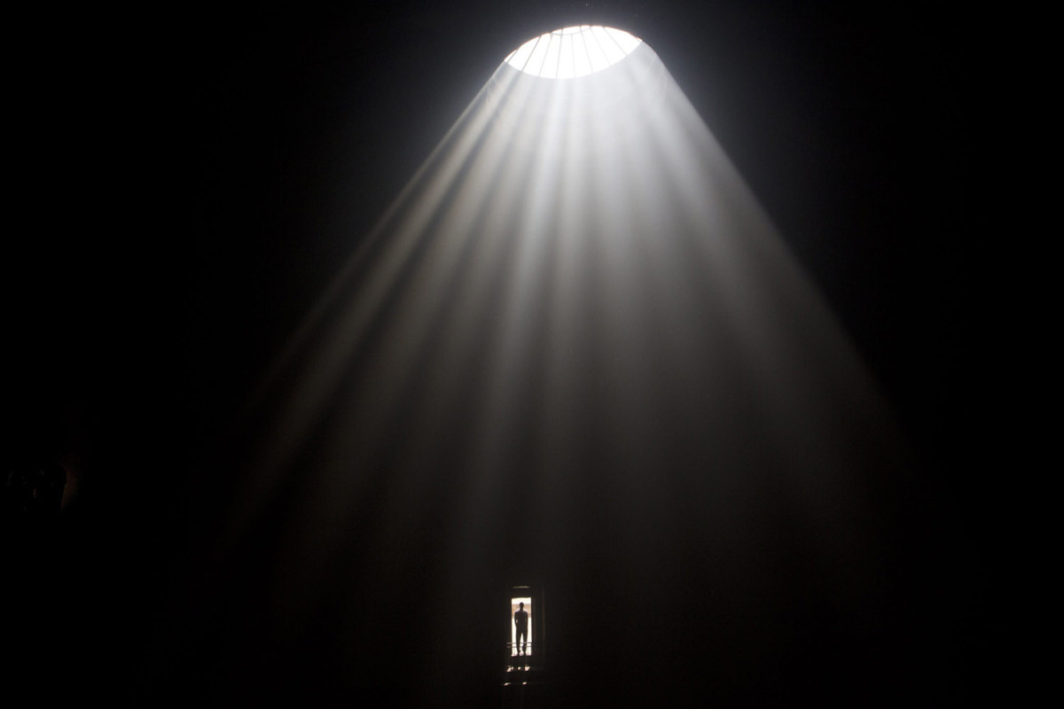 A man stands in the door of the church roof inside the Church of the Holy Sepulchre in Jerusalem during the Holy Fire ceremony the day before Easter. (Photo by Abir Sultan/EPA via LightBox)