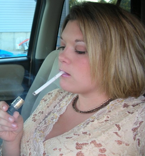 captkmnus: Nikki (1 of 2) Love her smoking style she needs a cock to suck on