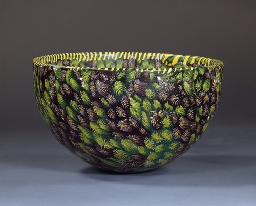 A glass bowl decorated using a technique called mosaic glass or millefiori (a thousand flowers) as t