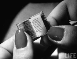 Herbert Gehr - Closeups of very small old book with lady holding it, 1949.
