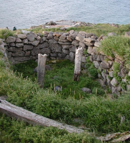 The abandoned village of Naukan in Mechigmanskiy Bay, Cape Dezhnev(Siberia, Russia).The abandoned vi