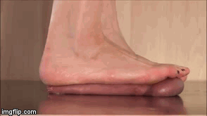 Beautiful blonde goddess with stunning feet crushing his left nut then allowing him to cum.