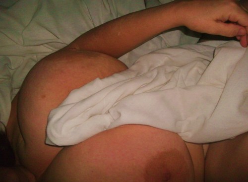 hugetitassluvr4:  mylonelybreasts:  misc. in bed shots…  In bed? Never mind…not going there! 