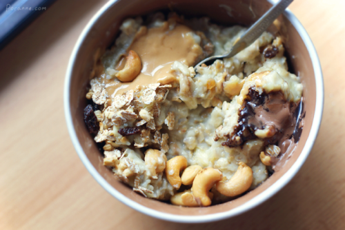 fitblrx:healthy-and-hungry:oatmeal with custard powder, banana, musli, cashews nuts, chocolate and p