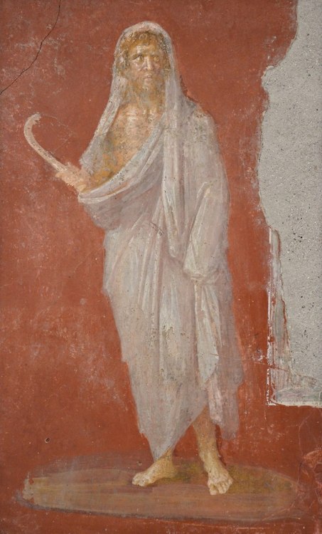  Saturnus holding a scythe, From House of Dioscuri, Pompeii. Saturn was  - among othe things - a god