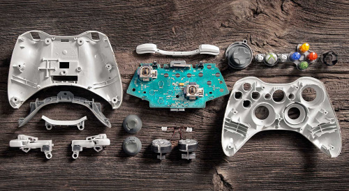 cinemagorgeous:  Many generations of game controllers, taken apart by Brandon Allen. 