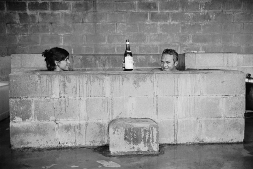 At Big Sur Steve McQueen and Neile Adams take a sulphur bath together, a bottle of wine propped near