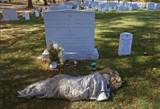 Sarah Stancyzk marked Veteran’s Day at the Arlington grave of her husband, Pvt. David Metzger, who was killed in Afghanistan in 2009 (Photo by Mark Wilson/Getty Images via Lens)