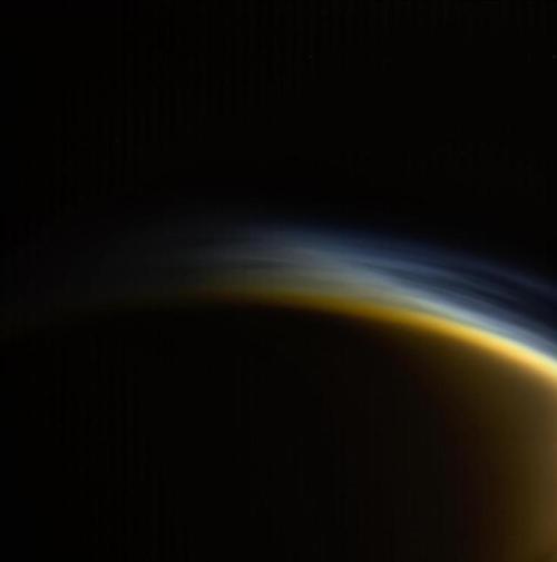 photos-of-space:Twilight Haze - the upper atmosphere of Titan [997 x 1007]