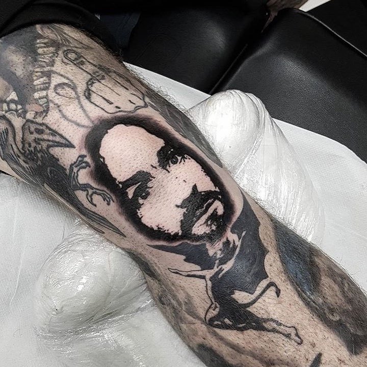Charles manson forearm tattoo