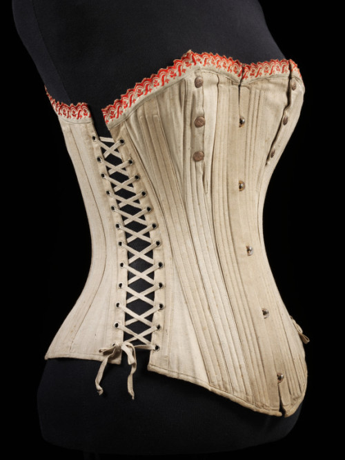 Corset 1875-1899 The Victoria &amp; Albert Museum The side ties and snaps over the breasts indic