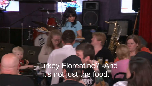 95% sure it's a group of people sitting at a table. Caption: -Turkey Florentine? -And it's not just the food.