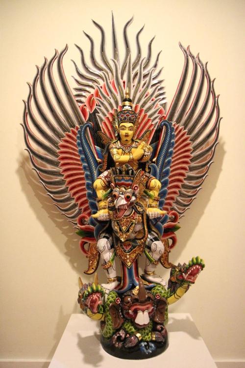 Vishnu riding Garuda, paitend wood from Bali