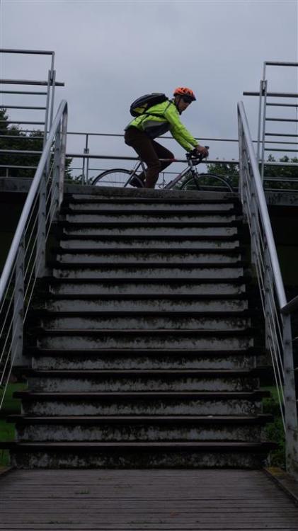 A Passing cyclist atop the stairway.…but do you know where we are going to? 