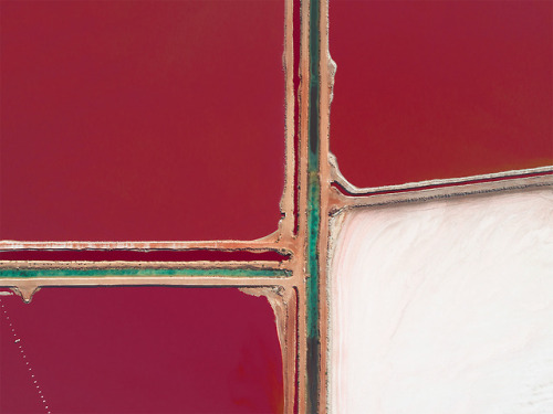 escapekit:  Australian Salt Germany-based photographer Kevin Krautgartner has captured the beauty of salt evaporation ponds, also called salterns. They are shallow artificial ponds designed to extract salts from sea water. To make it’s sea salt,