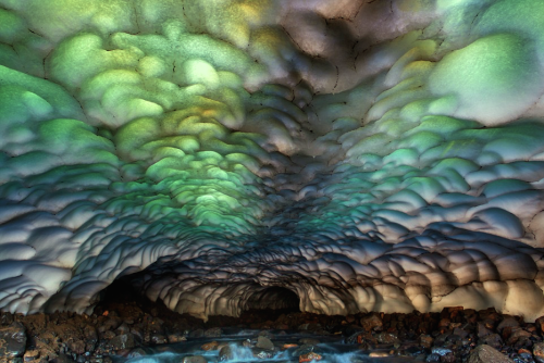 nubbsgalore:this ice cave on the kamchatka peninsula in russia was formed by a stream flowing beneat