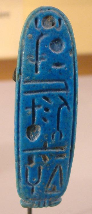 Ancient Egyptian faience cartouche containing the name of the lunar deity Khonsu-Neferhotep.  Artist