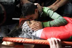 ummatii:  nowinexile:  Bahaa Bader’s twin brother kisses him before burial.  The 13 year old Palestinian boy was shot 3 times in the chest by an Israeli soldier last night in Beit Laqiya and died from severe bleeding.  Ya rab unite them in Jannat al