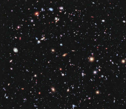 Images of over 10,000 galaxies captured by the Hubble Space Telescope. Each speck of light represent