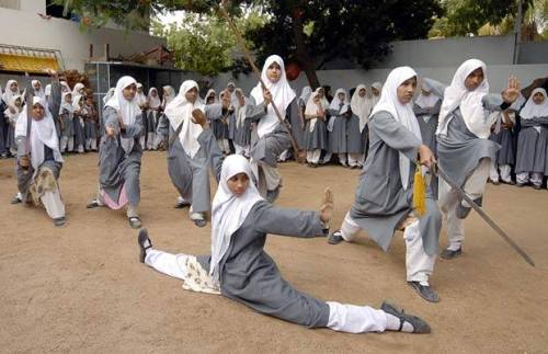 scowlofjustice:  rosebleue:  mvslim:    These Indian Muslim schoolgirls, all aged between 10 and 16 years old, are performing Vovinam, a Vietnamese martial art, at the Saint Maaz High School in Hyderabad. Encouraged by their parents and school officials,