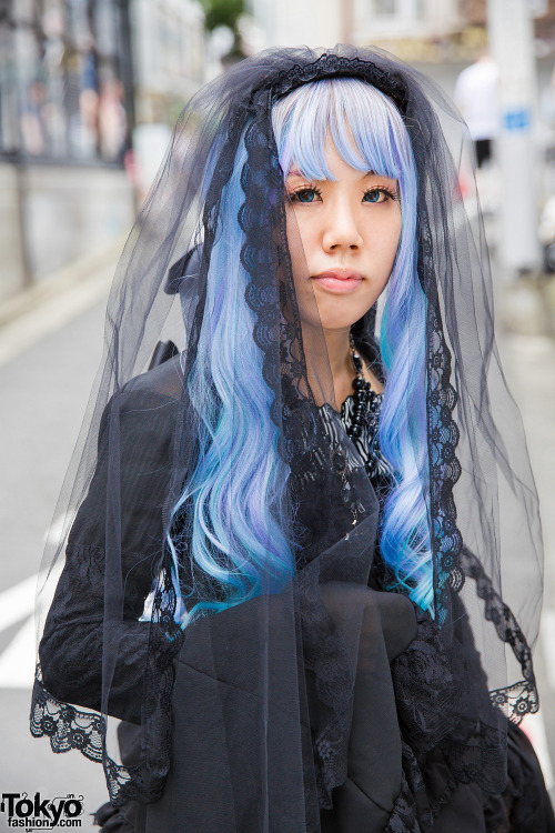 tokyo-fashion:  Keke wearing lolita fashion on the street in Harajuku with a Black Peace Now corset top, black lace skirt and lace jacket from Dangerous Nude Harajuku, and Nude Sox graphic tights. Full Look