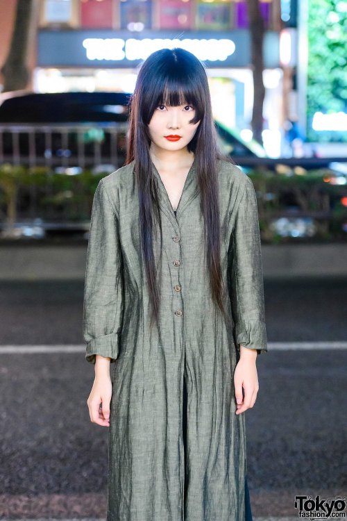 20-year-old Japanese student Kana on the street in Harajuku wearing a vintage linen maxi coat over a