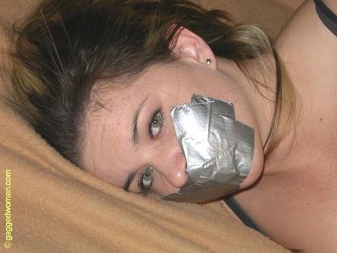 A fresh face gagged with some fresh tape.