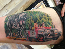 fuckyeahtattoos:  My Jurassic Park piece by Aaron Cooper at Good Omen Tattoo in Santa Cruz. http://benlol.tumblr.com