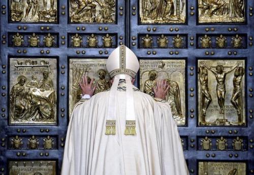 Pope Francis opened the Holy Door to mark the opening of the Catholic Holy Year, or Jubilee, in St. 