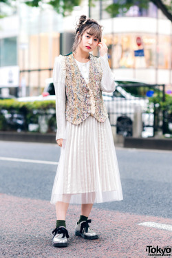 tokyo-fashion:  20-year-old Japanese student Mami on the street in Harajuku wearing a vintage pleated dress under a vintage floral brocade vest, and vintage silver bow-laced shoes. Full Look