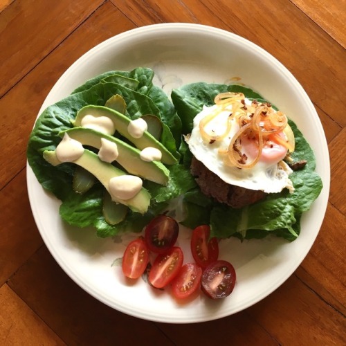 Beef burger with fried egg, onion, pickles, avocado, homemade mayo, tomatoes + lettuce. Assembled an