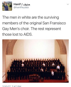 enoughtohold: This photo is actually from 1993, by Eric Luse of the San Francisco Chronicle, reprinted in 2006 with this caption: The Gay Men’s Chorus posed to illustrate the impact of AIDS. Those dressed in black, with their backs turned, represent