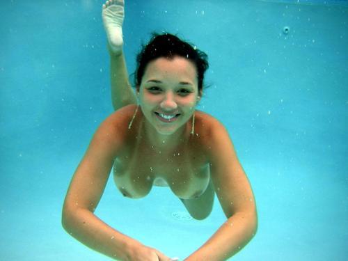 Naked girls swimming underwater