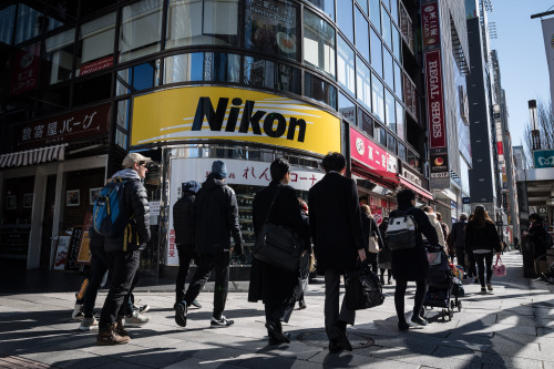 TOKYO - People pass by the shop of an iconic Nikon retailer in Ginza. Nikon Corporation announced th
