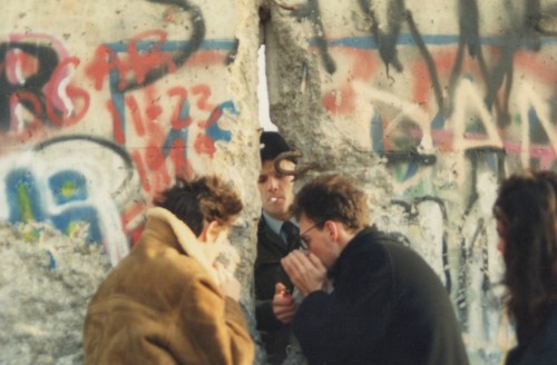 lt-rik:  A soldier of East german grenztruppen lights a cigarette at the fall of Berlin wall, 1989-1990.
