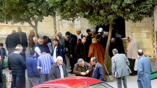 Holy Friday noon prayers end at the mosque outside my window