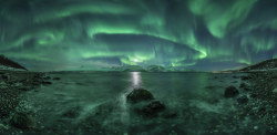 sixpenceee:  “Aurora Panorama”, by Jan R. Olsen, Norway  “The vivid green Northern Lights dance above Lyngenfjord, the longest fjord in Troms county Norway, tracing out the shape of the Earth’s magnetic field above the waters. The most common