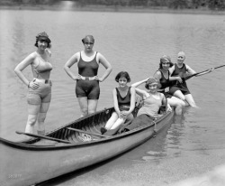  Girls of the 1920’s era arrayed on a boat and relaxing in their woolen bathing suits 