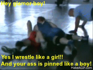 Love this.  Check out the cocky guy in his red spandex wrestling outfit.  He’s going to teach this female a lesson, that she doesn’t belong on the wrestling mat with her male superiors…..NOT!!  Instead she easily pins him in front
